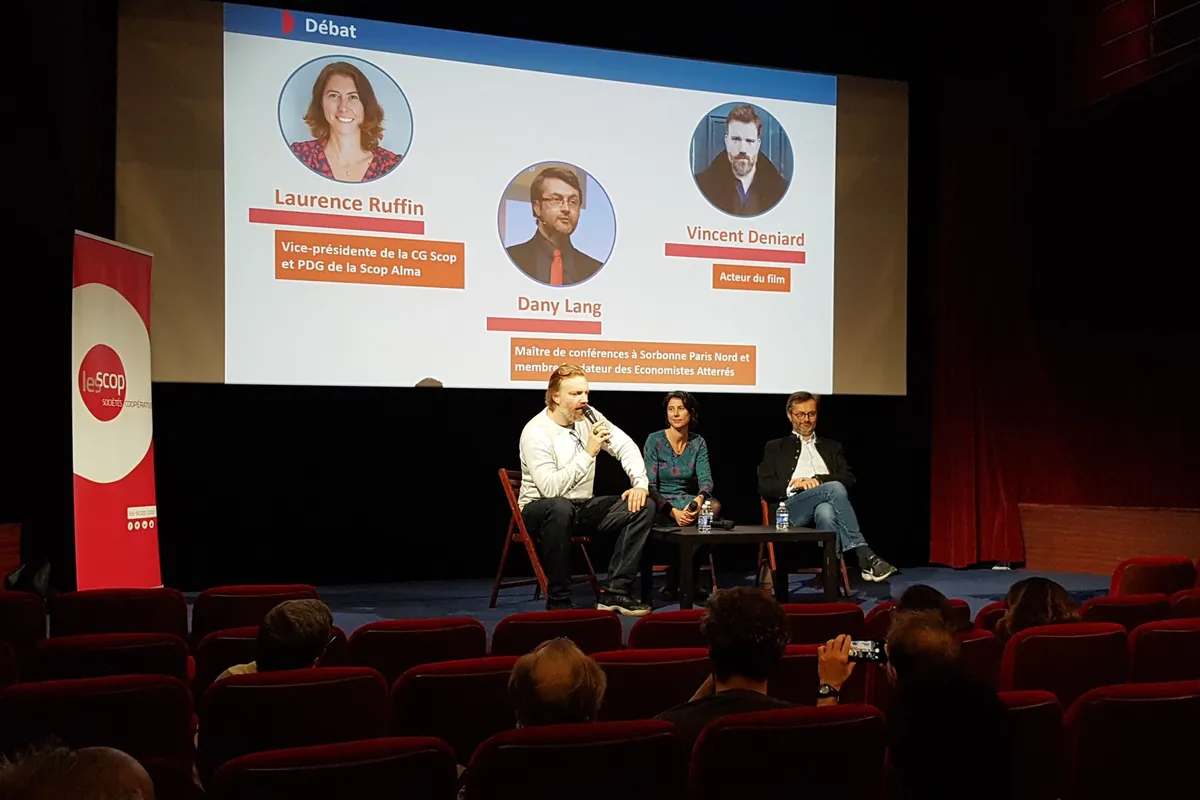 Speakers on stage during a panel discussion
